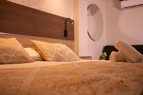 a hotel room with a bed with pillows at Cartagena Royal Hotel Boutique in Cartagena de Indias
