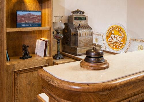 a room with a wooden counter with a stove at Villa Flavia Heritage Boutique Hotel in Plovdiv