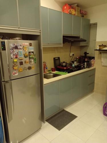 a kitchen with a stainless steel refrigerator with magnets at HOT!!!Tropics Homestay Private Male Dorm Damansara in Petaling Jaya