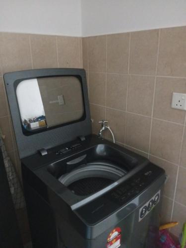 a washing machine in a bathroom with a mirror at HOT!!!Tropics Homestay Private Male Dorm Damansara in Petaling Jaya