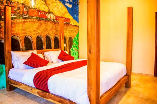 a bedroom with two bunk beds with white and red pillows at Eminence ella in Ella