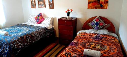Una cama o camas en una habitación de Hostel mágico San Blas