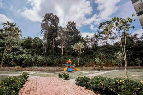 a playground with a fire hydrant in a park at Cameron Highlands*顶级公寓The Quintet Tanah Rata in Tanah Rata