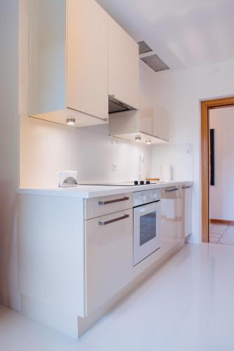 Zimmer & Appartements in der Gamlitzerstrasseにあるキッチンまたは簡易キッチン