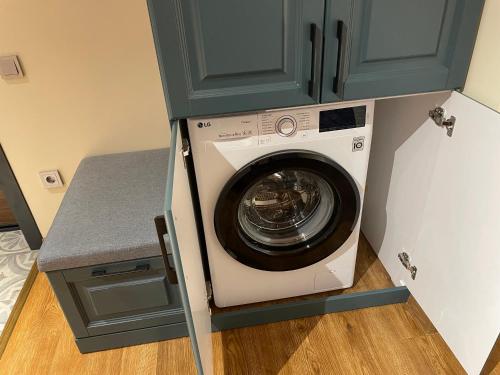 a washer and dryer in a utility room at Covent Garden in Tashkent