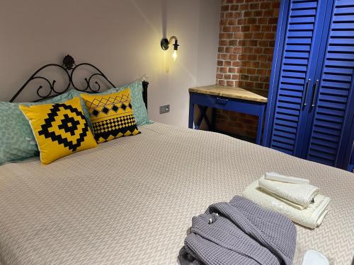 a bedroom with a bed with towels on it at Covent Garden in Tashkent