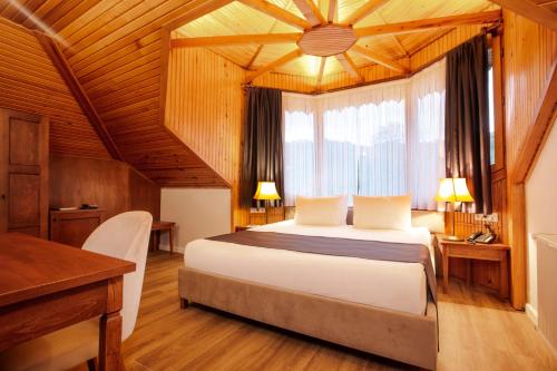 Postel nebo postele na pokoji v ubytování Zanike hotel