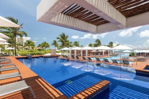 a pool at the resort at La Amada Residences Luxury in Cancún