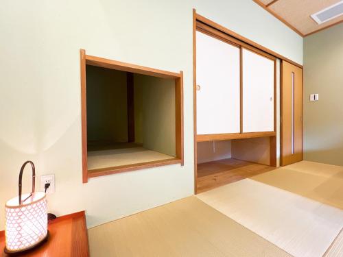 Postel nebo postele na pokoji v ubytování OWL RESORT ARIFUKU ONSEN