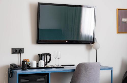 Una televisión o centro de entretenimiento en Narva Hotell & Spaa