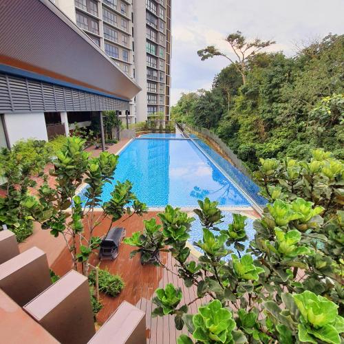 a view of a swimming pool from a building at The Glass Homestay Putrajaya in Putrajaya