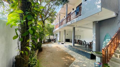 an empty alley in a building with a balcony at The Point Mirissa in Mirissa