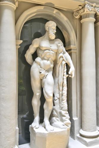 a statue of a man standing in front of a building at Casa Ellul - Small Luxury Hotels of the World in Valletta