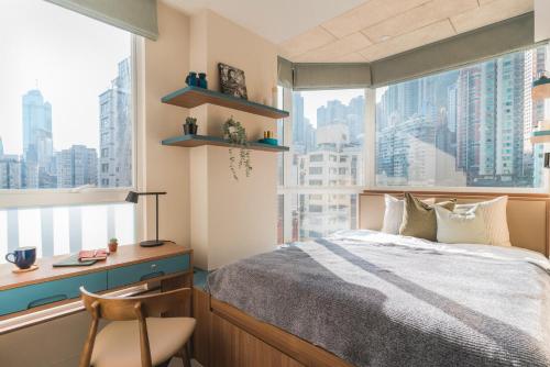 Ένα ή περισσότερα κρεβάτια σε δωμάτιο στο Weave Suites - Central West