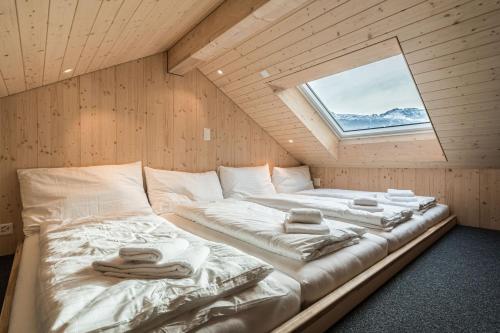 מיטה או מיטות בחדר ב-Melchtal Resort Apart Hotel