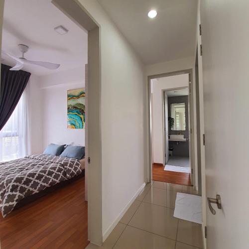 a bedroom with a bed and a mirror at The Glass Homestay Putrajaya in Putrajaya