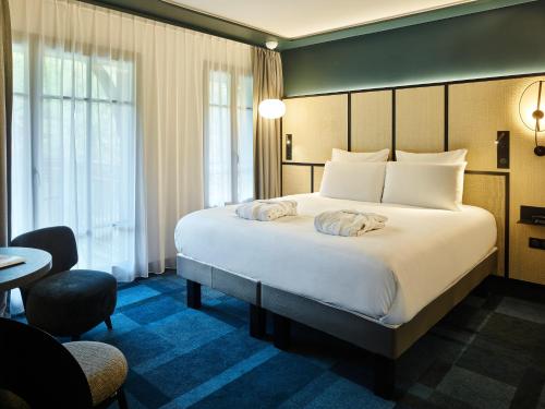 Posteľ alebo postele v izbe v ubytovaní Mercure Hôtel Le Touquet