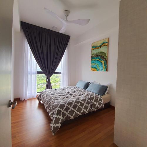 a bedroom with a bed and a ceiling fan at The Glass Homestay Putrajaya in Putrajaya