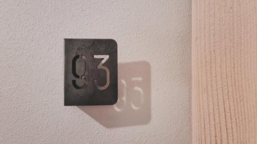 a switch on a wall with the number six on it at Bardoliners in Bardolino