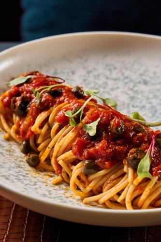 a plate of spaghetti with meatballs and sauce at Radisson Blu Hotel, Cairo Heliopolis in Cairo