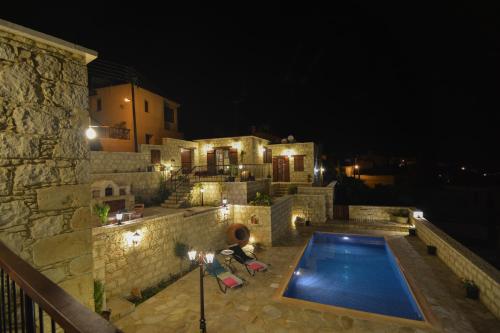 a house with a swimming pool at night at Aliki's House 1+ 2 in Polis Chrysochous
