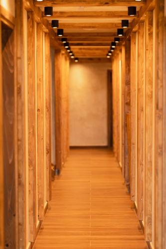 a hallway of a building with wooden walls at ETNO SELO VRANEŠA Zlatar in Nova Varoš