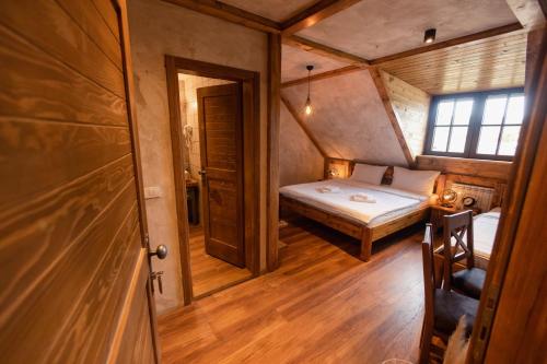 a small room with a bed and a window at ETNO SELO VRANEŠA Zlatar in Nova Varoš