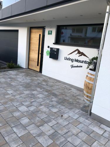 a front door of a living mamma building at Living Mountain Tannheim in Tannheim