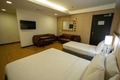Ένα ή περισσότερα κρεβάτια σε δωμάτιο στο Citrus Hotel Johor Bahru by Compass Hospitality