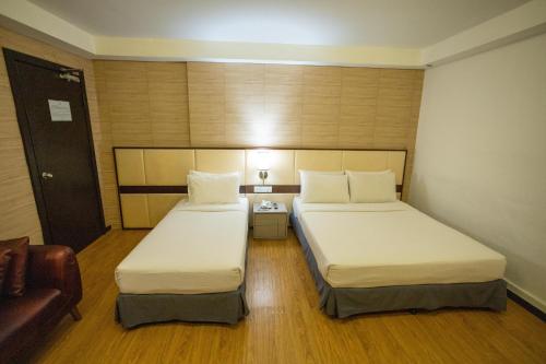 Ένα ή περισσότερα κρεβάτια σε δωμάτιο στο Citrus Hotel Johor Bahru by Compass Hospitality