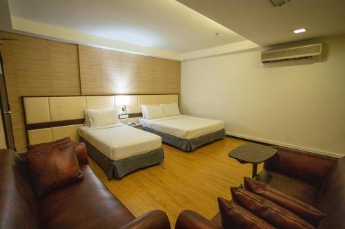 Ένα ή περισσότερα κρεβάτια σε δωμάτιο στο Citrus Hotel Johor Bahru by Compass Hospitality