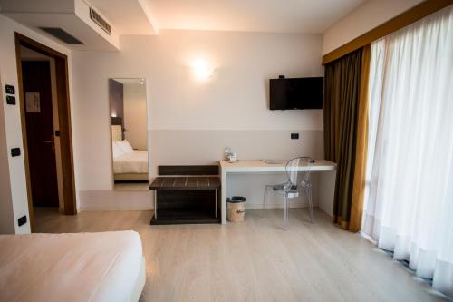 TV a/nebo společenská místnost v ubytování Hotel L'Approdo