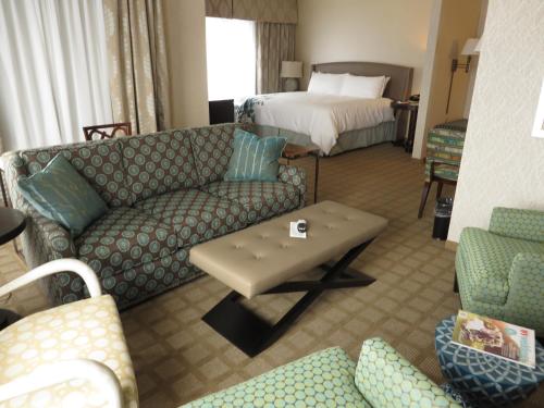 a living room with a couch and a bed at Wingate by Wyndham Elkins in Elkins