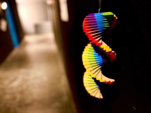 a colorful kite hanging from a wall at Swiss Inn in Sapporo