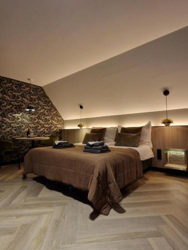 Ein Bett oder Betten in einem Zimmer der Unterkunft Het Pauwtje