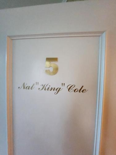 a sign on a door with a number on it at Hotel Millennium in Locarno