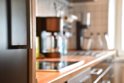 a counter in a kitchen with a coffee maker at Ferienwohnung Happynest in Birresborn