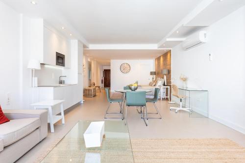 a living room with a couch and a table at Rooms & Suites Loft 2G Deluxe Edition Arrecife in Arrecife