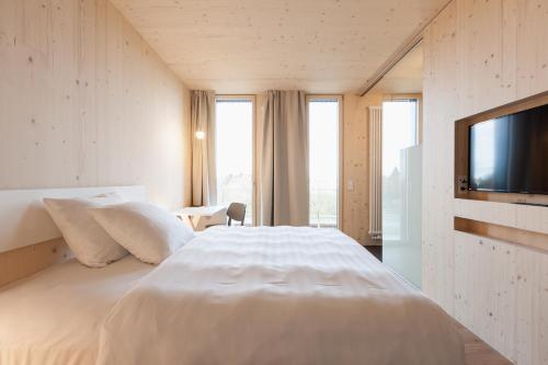 Postel nebo postele na pokoji v ubytování Bader Hotel