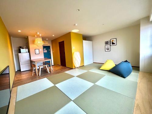 a living room with a checkered floor at Swiss Inn in Sapporo