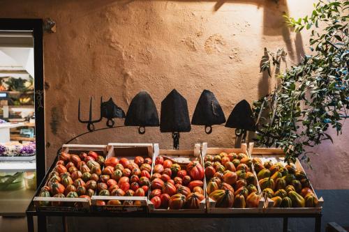 a display of fruits and vegetables on a table at Agriturismo Rose di Pietra in Pietra Ligure