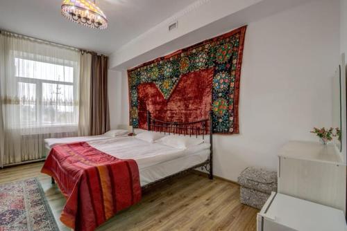 Кровать или кровати в номере Olive hotel Kochkor