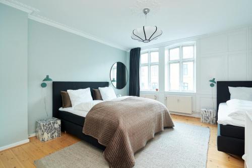 Letto o letti in una camera di Large Modern Apartments By Meat Packing District in central Copenhagen