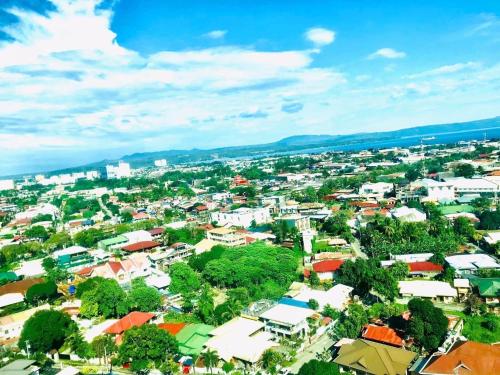 an overhead view of a city with buildings and trees at Abreeza Place by Chriza in Davao City