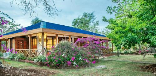 a house with flowers in front of it at Miraflores Boutique Hotel Adults Only in San Andrés