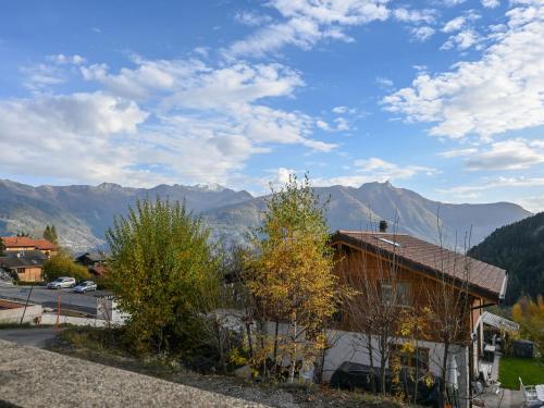 a house with a view of the mountains at Apartment Caroubier 2 by Interhome in Ovronnaz