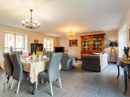 a dining room with a table and chairs at Holiday Home La Lucerie - BAY402 by Interhome in Bretteville-sur-Ay
