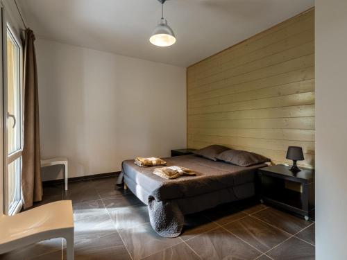 Ένα ή περισσότερα κρεβάτια σε δωμάτιο στο Apartment Residence Marina di Favone- T3- 4-6 pers-2 by Interhome