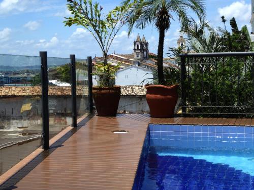 a swimming pool on the roof of a house at Hotel Casa do Amarelindo in Salvador