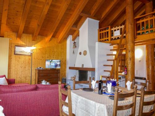 a living room with a table and a couch at Holiday Home Mona by Interhome in Leontica
